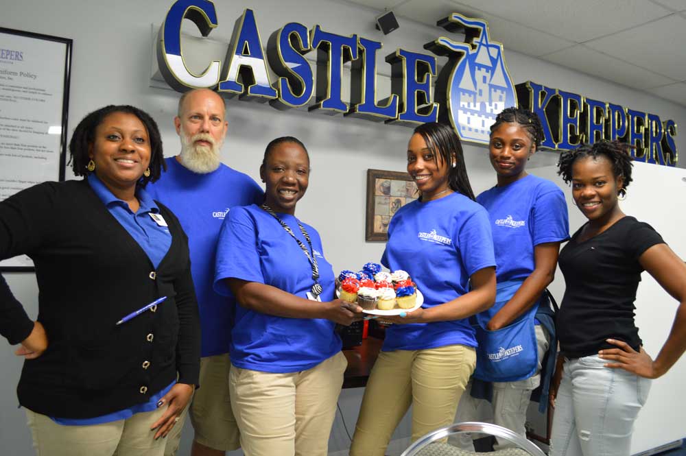 Castle Keeper Crew Holding Cupcakes