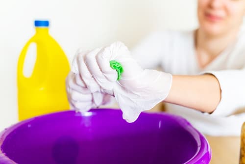 What surfaces should not be cleaned with bleach